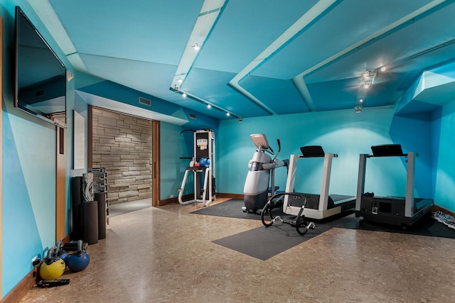 workout room with visible vents and baseboards