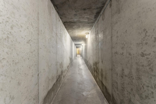 hall featuring concrete floors