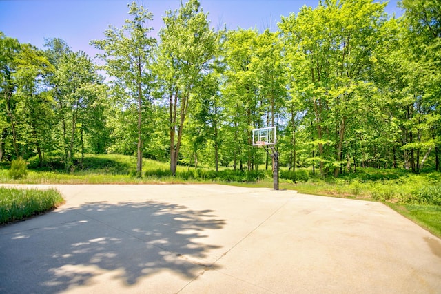 view of sport court featuring basketball hoop