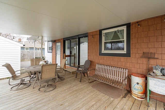 wooden deck featuring outdoor dining space