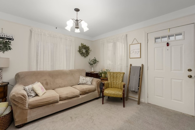 living room featuring an inviting chandelier and carpet floors