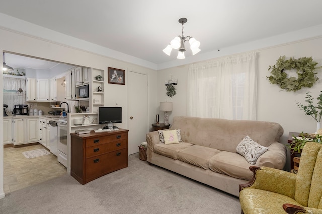 living room with light colored carpet and a notable chandelier