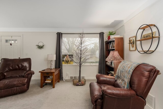 sitting room with carpet flooring and visible vents