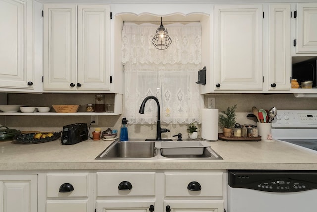 kitchen with open shelves, light countertops, white dishwasher, and a sink