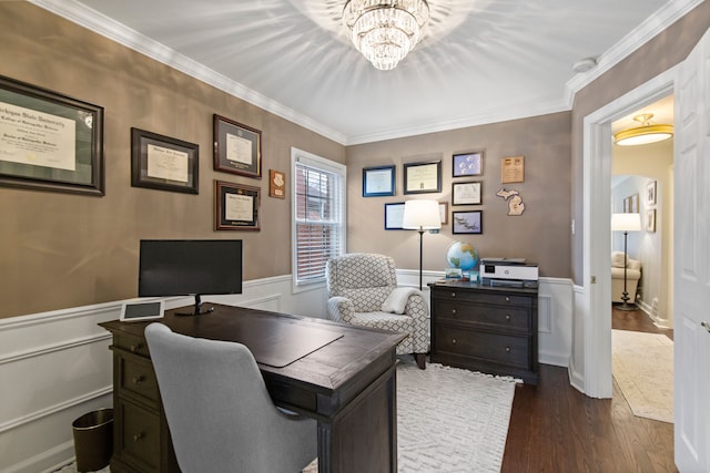 home office with an inviting chandelier, ornamental molding, dark wood-type flooring, and wainscoting