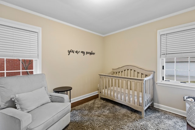 bedroom with baseboards and crown molding