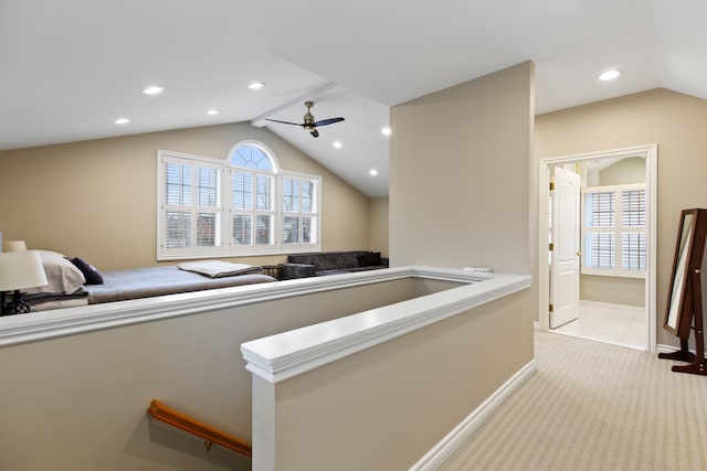 hall with vaulted ceiling, light carpet, baseboards, and recessed lighting