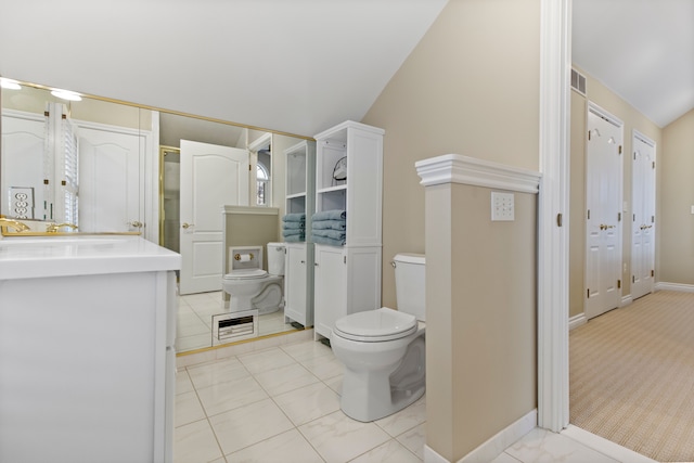 bathroom featuring visible vents, toilet, vaulted ceiling, vanity, and baseboards