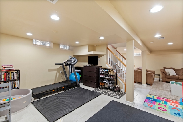 exercise area featuring recessed lighting, tile patterned flooring, and visible vents