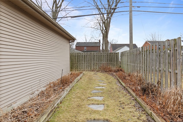 view of yard with a fenced backyard