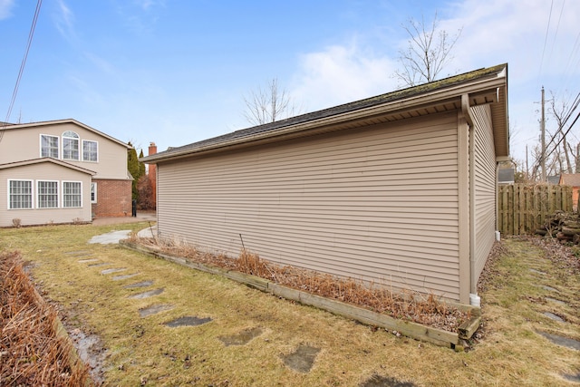 view of home's exterior featuring fence