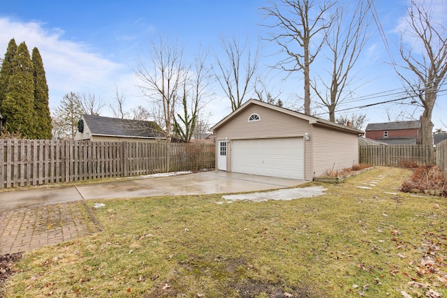 detached garage featuring fence