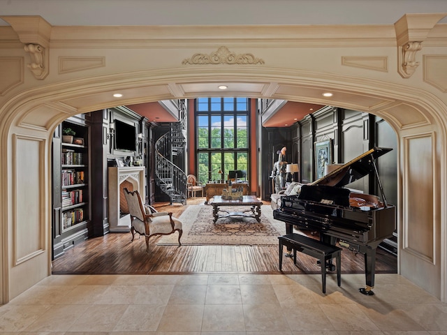 living area with tile patterned flooring and stairway