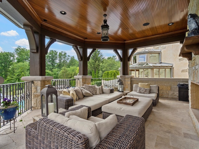 view of patio / terrace featuring an outdoor living space with a fire pit