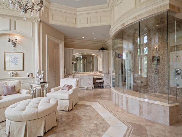 bathroom featuring ornamental molding, a shower stall, and vanity