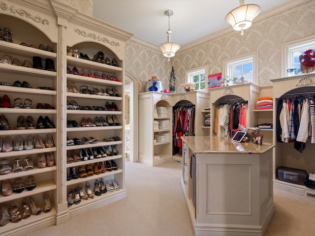 spacious closet featuring light carpet