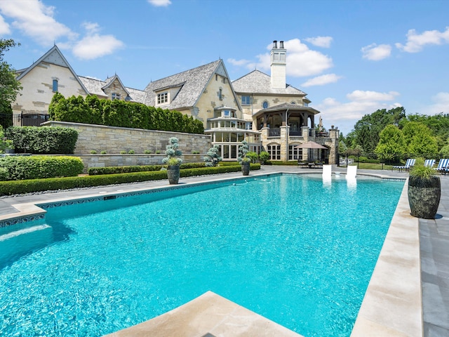 view of pool with a patio, fence, and a fenced in pool