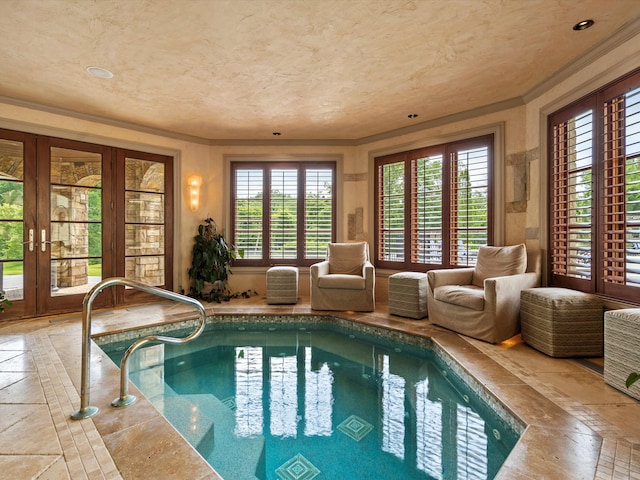 indoor pool with a jacuzzi and french doors