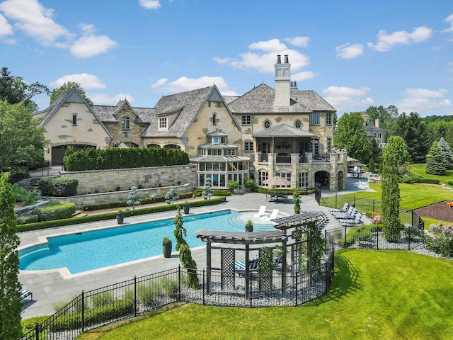 view of pool featuring a fenced in pool, fence, a patio, and a lawn