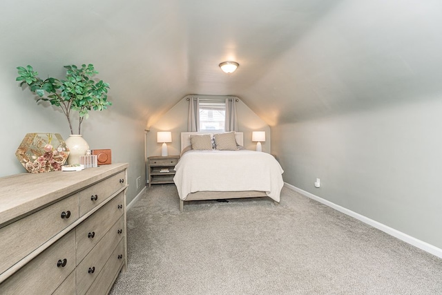 bedroom with baseboards and light colored carpet