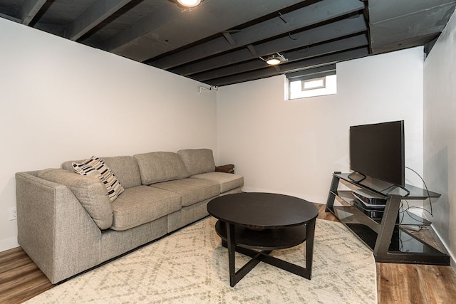 living room featuring wood finished floors and baseboards