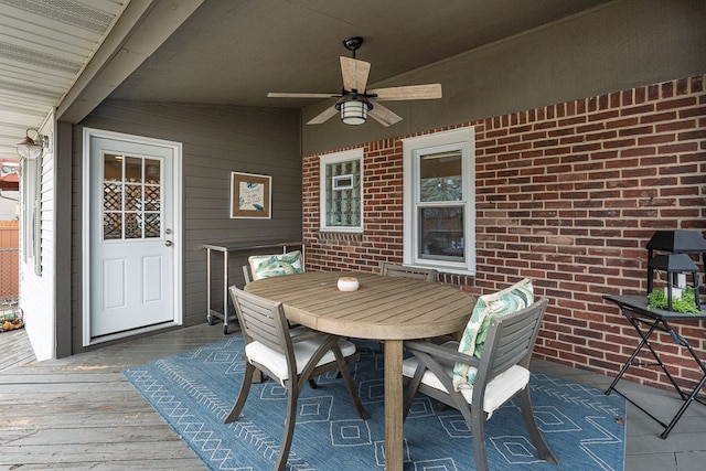 view of patio featuring a ceiling fan and outdoor dining area