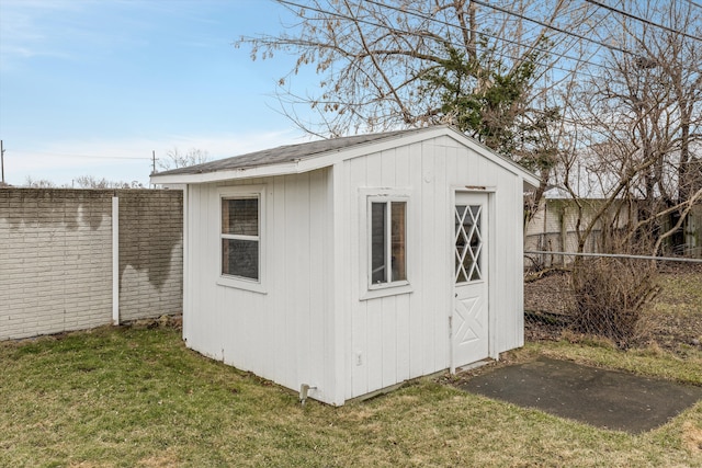 view of shed with fence