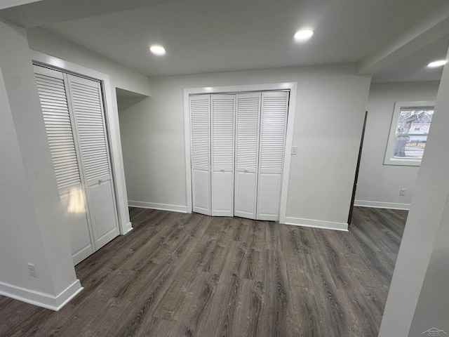 unfurnished bedroom featuring dark wood-style floors, recessed lighting, and baseboards