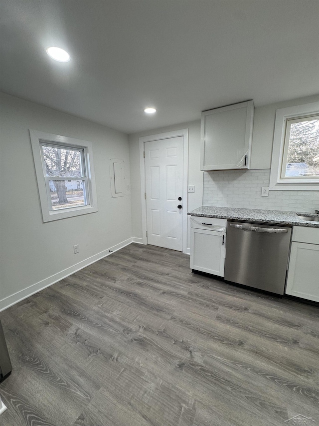 kitchen with baseboards, white cabinets, dark wood finished floors, dishwasher, and backsplash