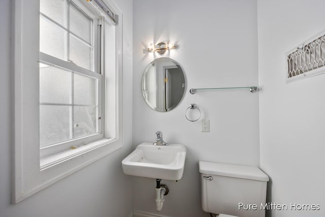 bathroom featuring a sink and toilet