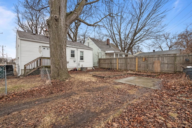 view of yard with fence and a patio