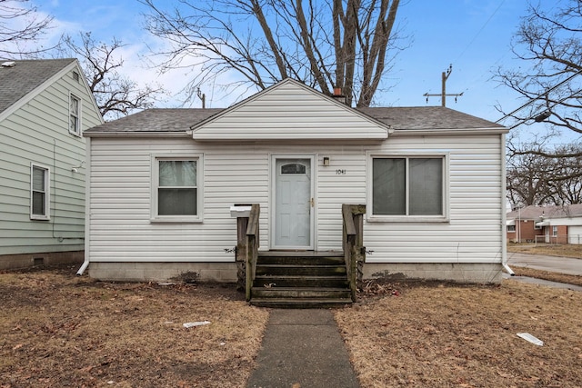 bungalow-style house featuring entry steps and a shingled roof