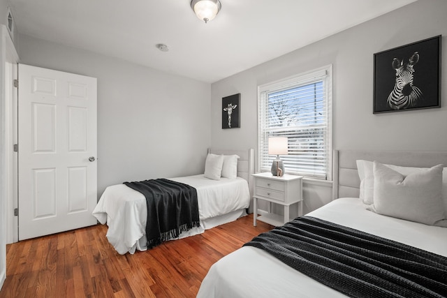 bedroom featuring wood finished floors