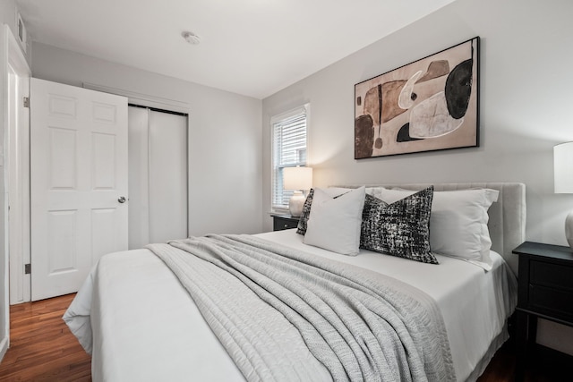 bedroom with a closet and wood finished floors