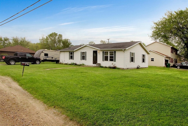 ranch-style house featuring a front lawn