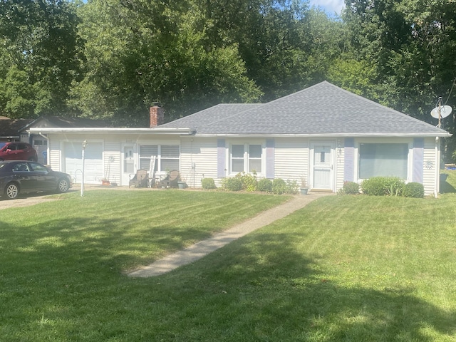 single story home featuring a front lawn, a chimney, an attached garage, and a shingled roof