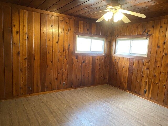 2609 Stanley Ave, Portage, MI 49002 - spare room featuring a ceiling fan, wood walls, wood finished floors, and wood ceiling