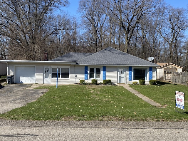2609 Stanley Ave, Portage, MI 49002 - single story home featuring a shingled roof, aphalt driveway, a front lawn, and an attached garage