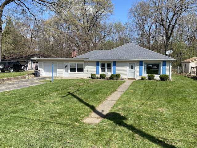 2609 Stanley Ave, Portage, MI 49002 - view of front of house with a front lawn, aphalt driveway, a shingled roof, and an attached garage