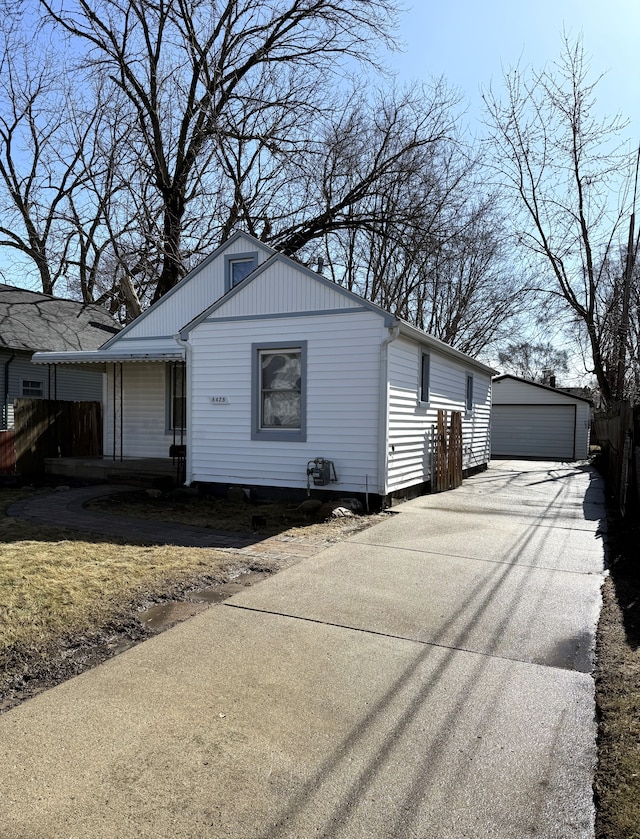 view of front facade with a garage and an outdoor structure