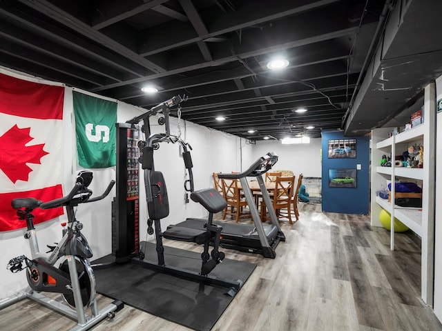 workout room featuring wood finished floors