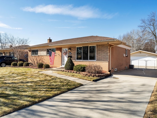 view of front of property with a garage, brick siding, an outdoor structure, a front lawn, and a chimney