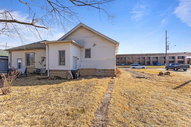 back of house featuring crawl space