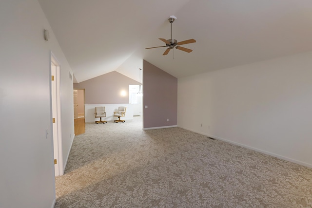 bonus room featuring carpet flooring, vaulted ceiling, baseboards, and ceiling fan