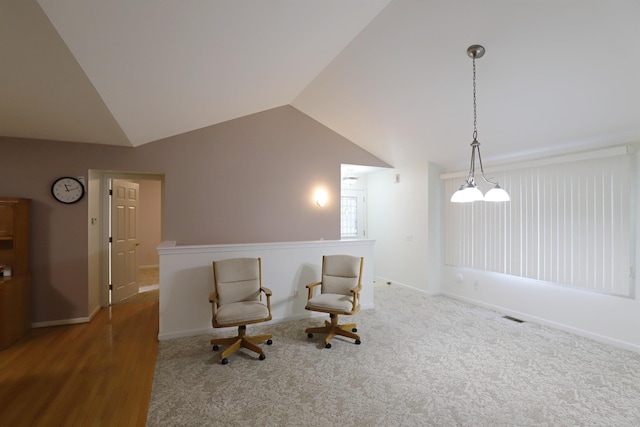 unfurnished room with lofted ceiling, carpet, visible vents, and baseboards