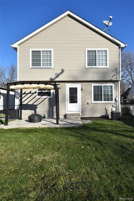 back of property featuring a yard, fence, a pergola, and a patio