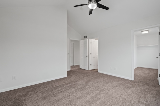 unfurnished bedroom featuring carpet floors, baseboards, visible vents, and a walk in closet