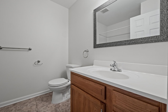 bathroom with baseboards, visible vents, toilet, tile patterned flooring, and vanity