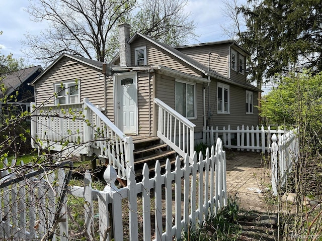 24067 Sargent Ave, Southfield, MI 48033 - back of house with a chimney