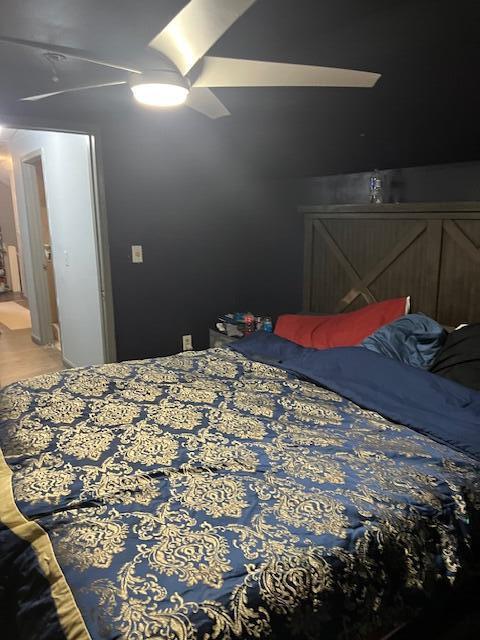 bedroom featuring ceiling fan and wood finished floors